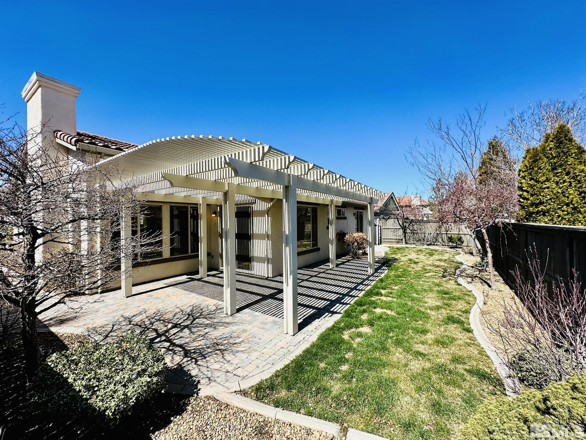491 Oldenburg Drive Reno, NV 89521 - Photo 15 of 36 a front view of a house with a yard