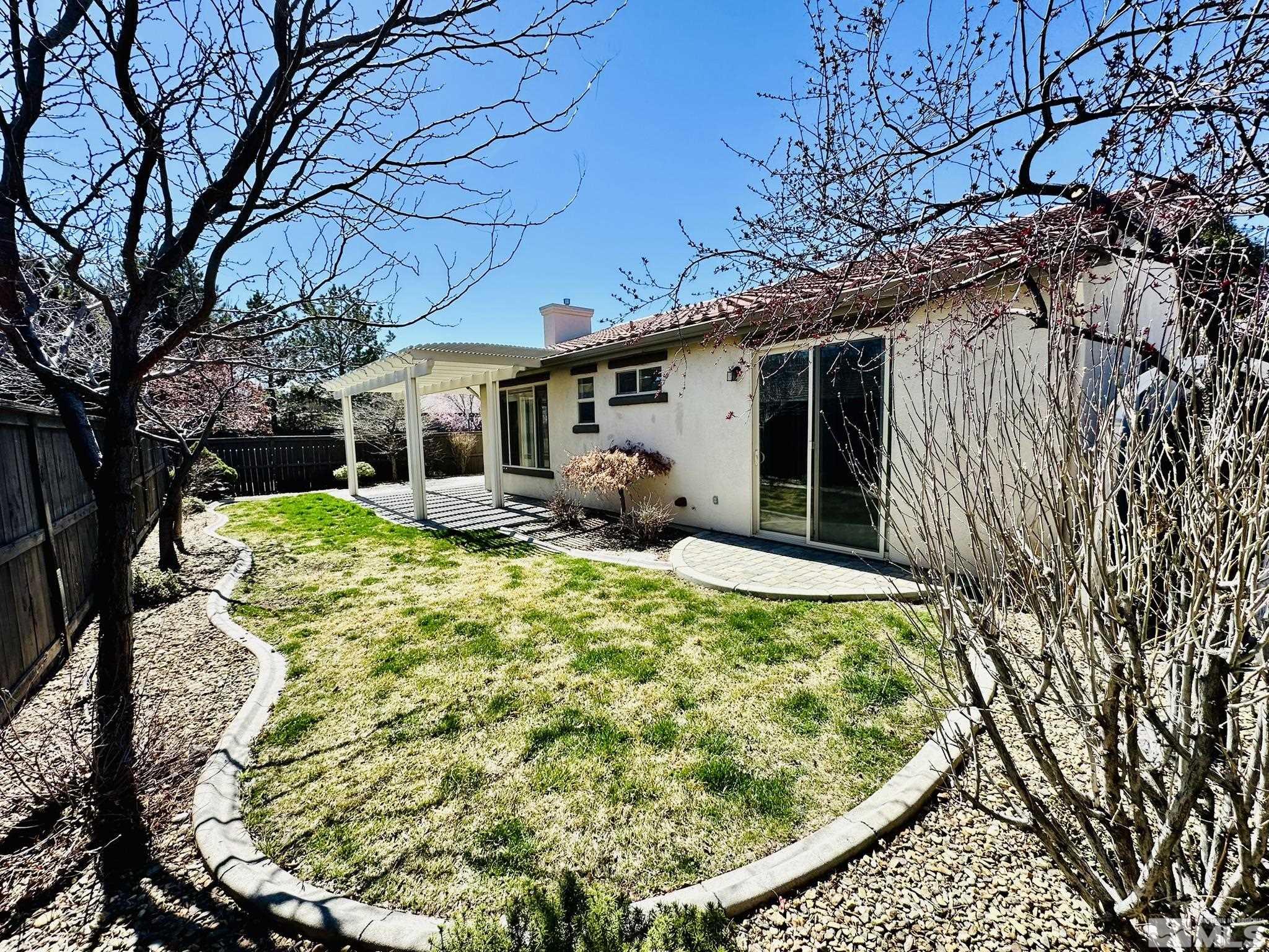 491 Oldenburg Drive Reno, NV 89521 - Photo 16 of 36 a view of a house with backyard