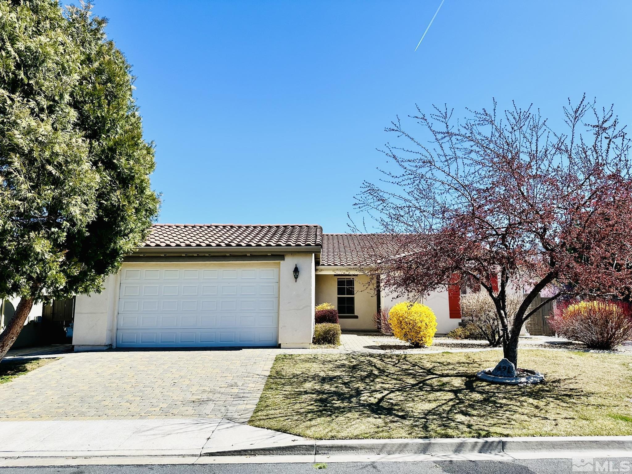 491 Oldenburg Drive Reno, NV 89521 - Photo 2 of 36 a front view of a house with a yard