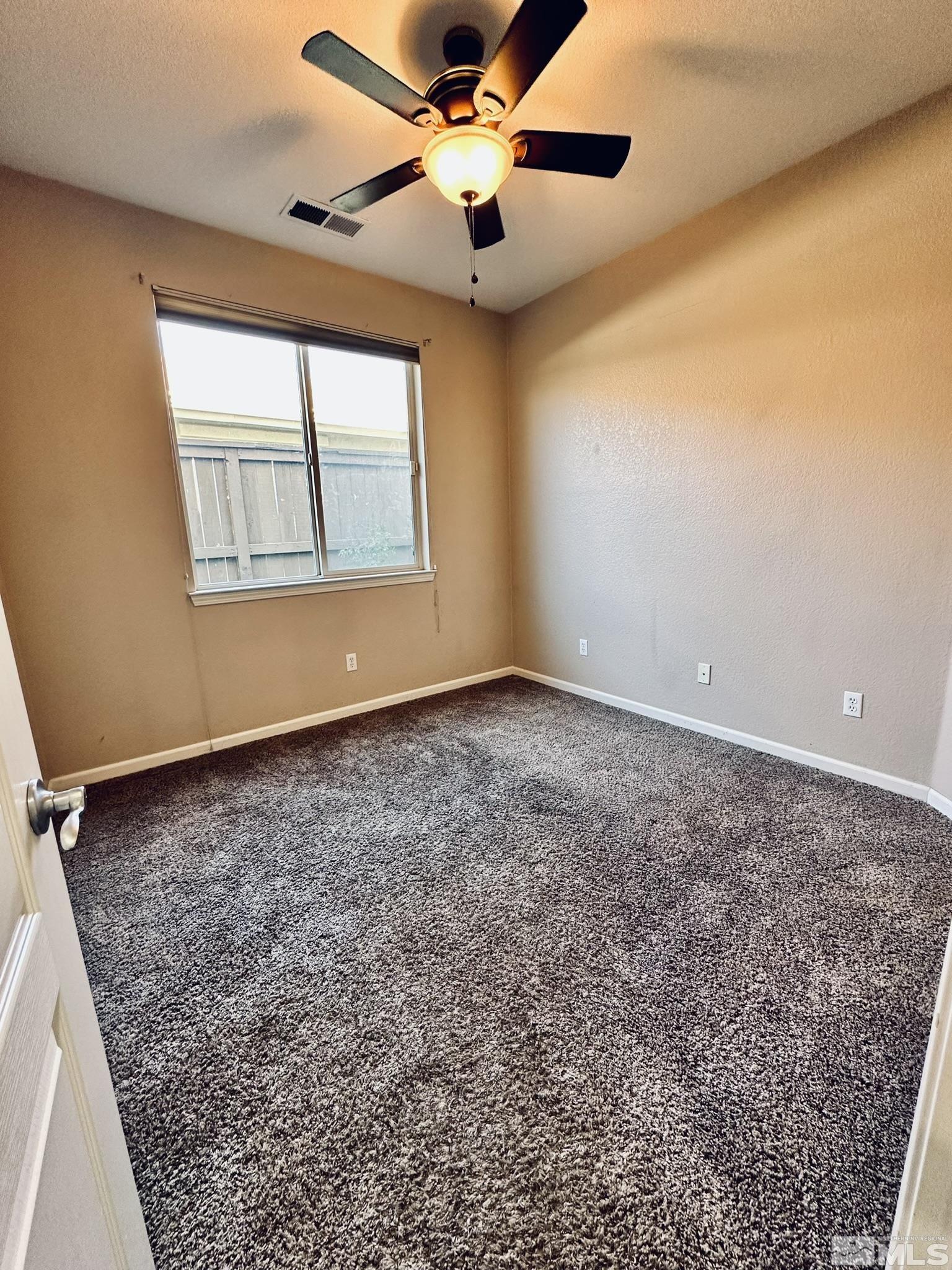 491 Oldenburg Drive Reno, NV 89521 - Photo 25 of 36 a view of an empty room with a window