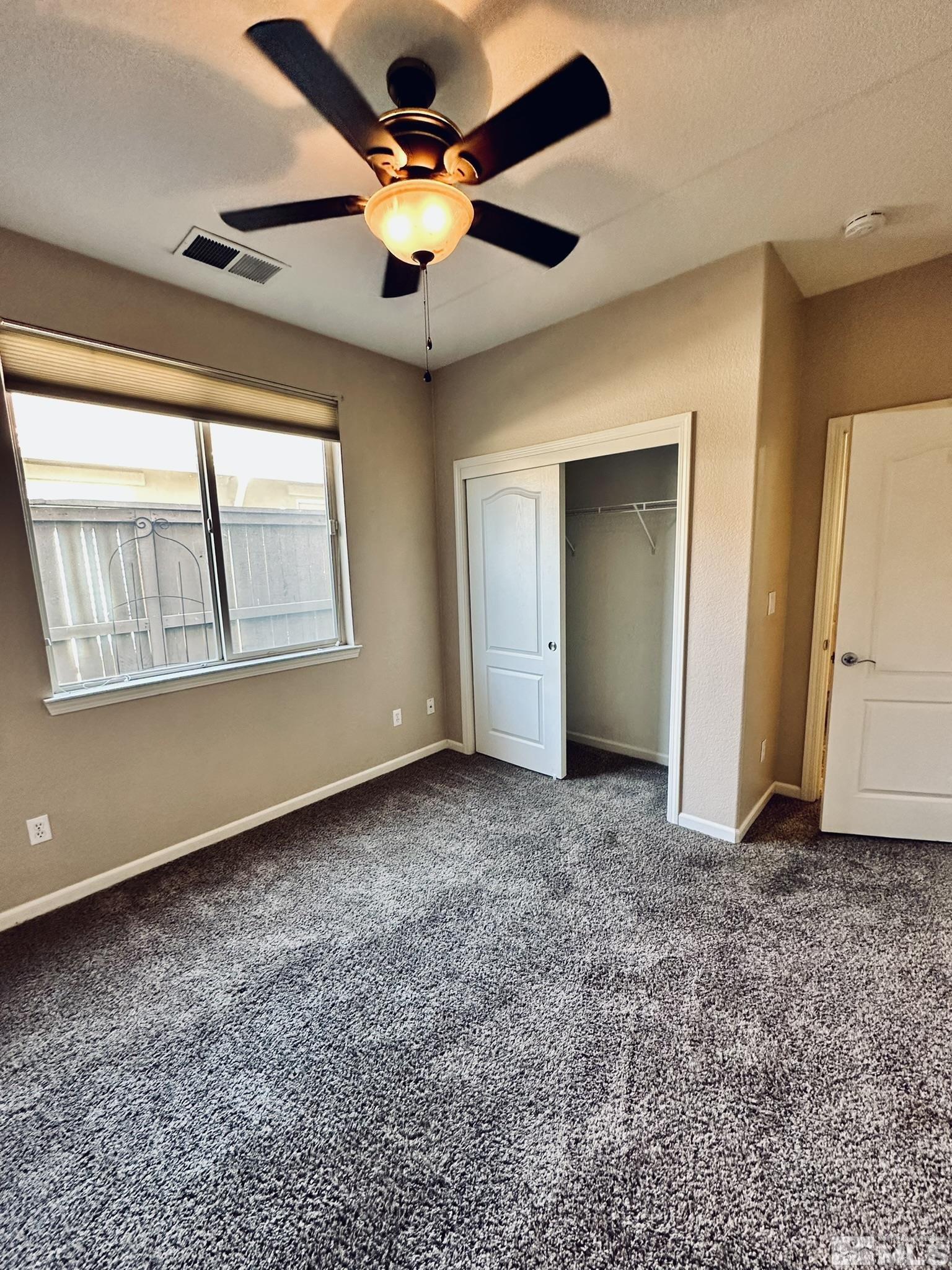 491 Oldenburg Drive Reno, NV 89521 - Photo 30 of 36 a view of an empty room with a window
