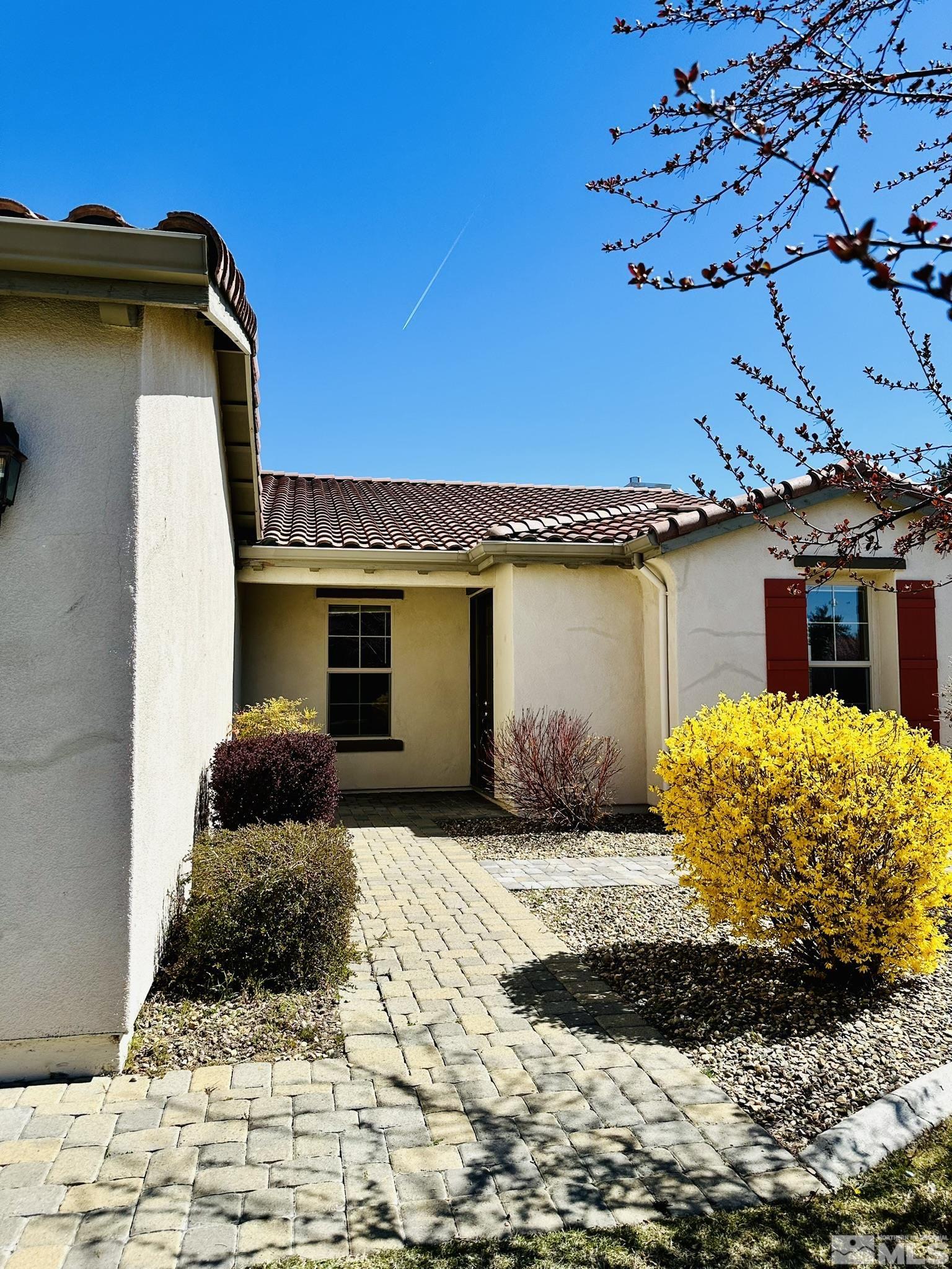 491 Oldenburg Drive Reno, NV 89521 - Photo 3 of 36 a front view of a house with a yard