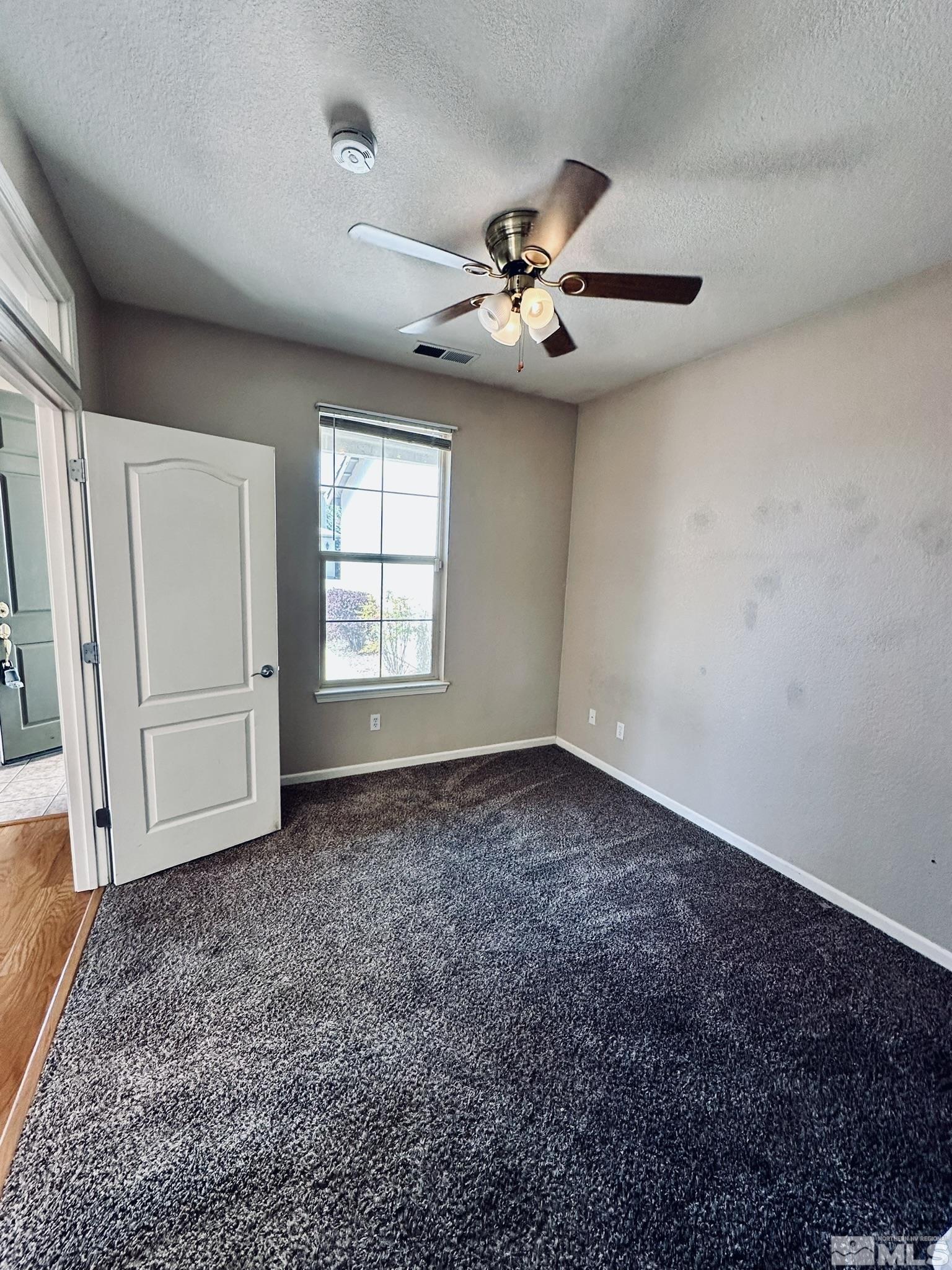 491 Oldenburg Drive Reno, NV 89521 - Photo 35 of 36 a view of an empty room with a window