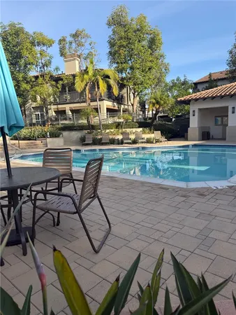 a view of a swimming pool with a patio