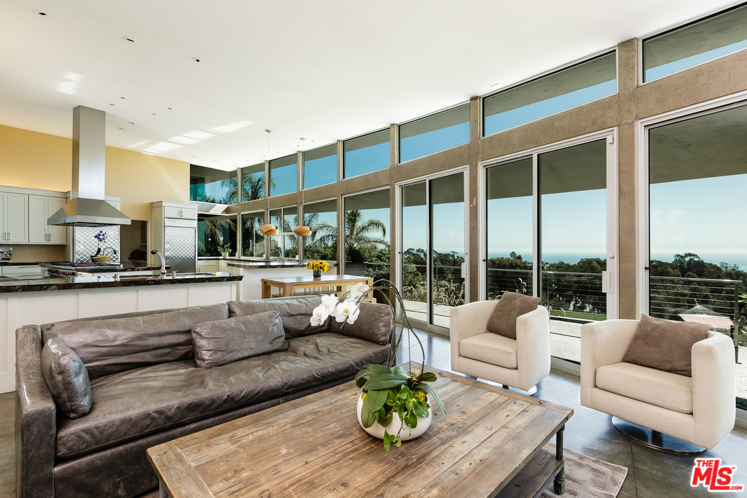 27366 Winding Way Malibu, CA 90265 - Photo 13 of 43 a living room with furniture and a large window