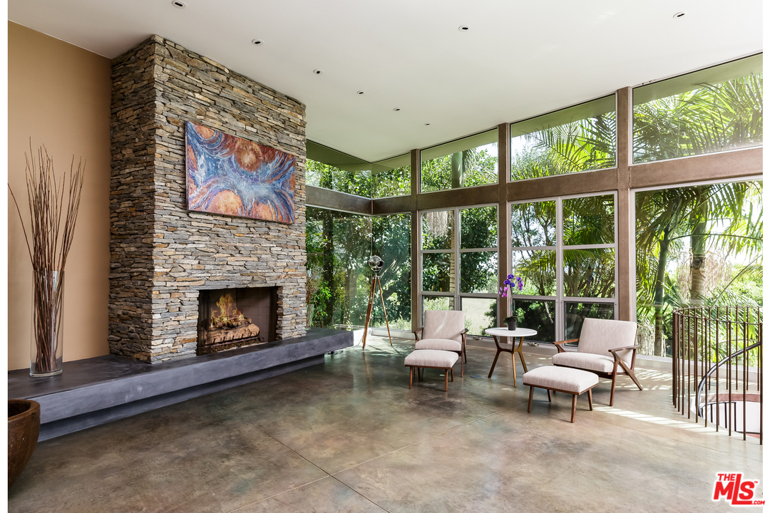 27366 Winding Way Malibu, CA 90265 - Photo 16 of 43 a living room with furniture and a fireplace