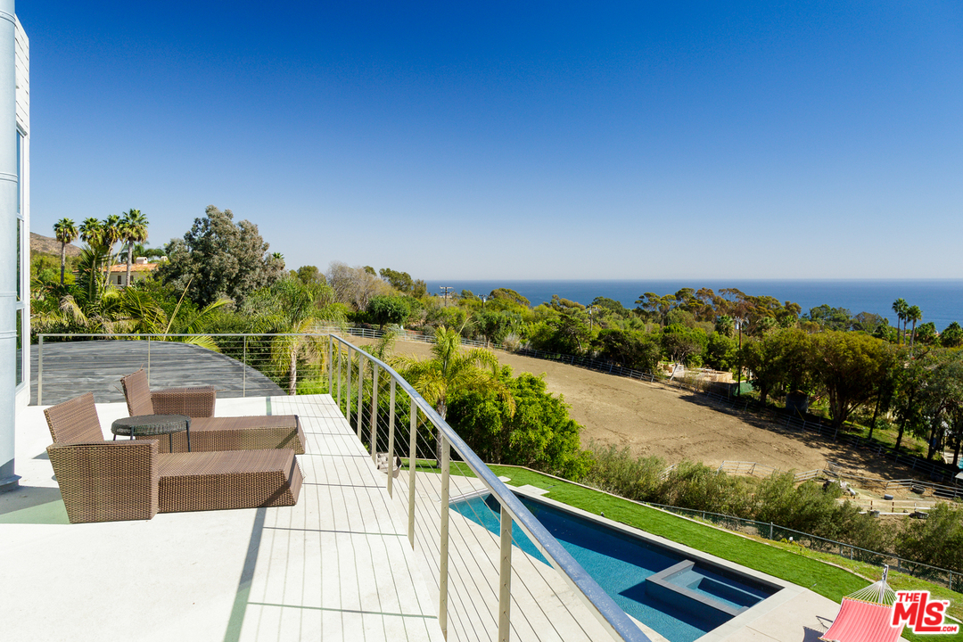 27366 Winding Way Malibu, CA 90265 - Photo 21 of 43 a view of a balcony with wooden floor & fence