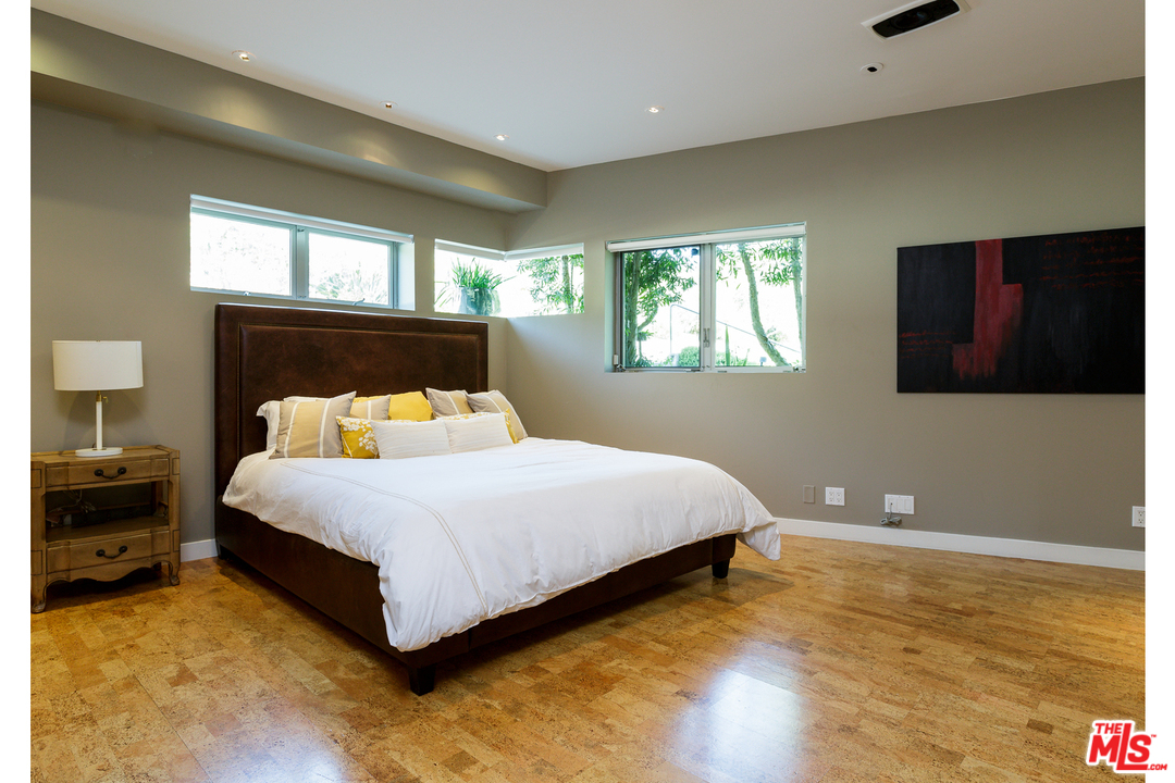 27366 Winding Way Malibu, CA 90265 - Photo 29 of 43 a bedroom with a bed and window