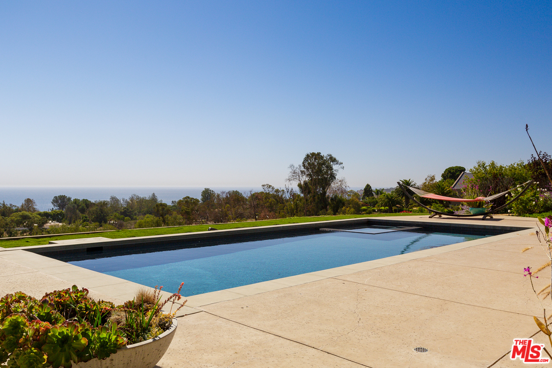 27366 Winding Way Malibu, CA 90265 - Photo 4 of 43 a view of a swimming pool and lounge chair