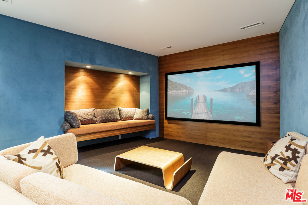 27366 Winding Way Malibu, CA 90265 - Photo 31 of 43 a living room with furniture and a flat screen tv