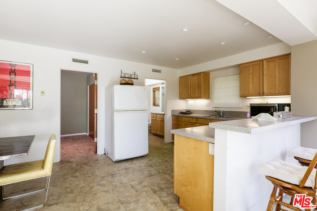 27366 Winding Way Malibu, CA 90265 - Photo 35 of 43 a kitchen with a refrigerator a stove and a refrigerator