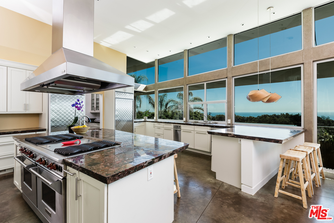 27366 Winding Way Malibu, CA 90265 - Photo 9 of 43 a kitchen with a stove and a sink