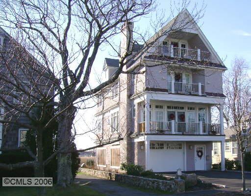 a front view of residential houses with yard
