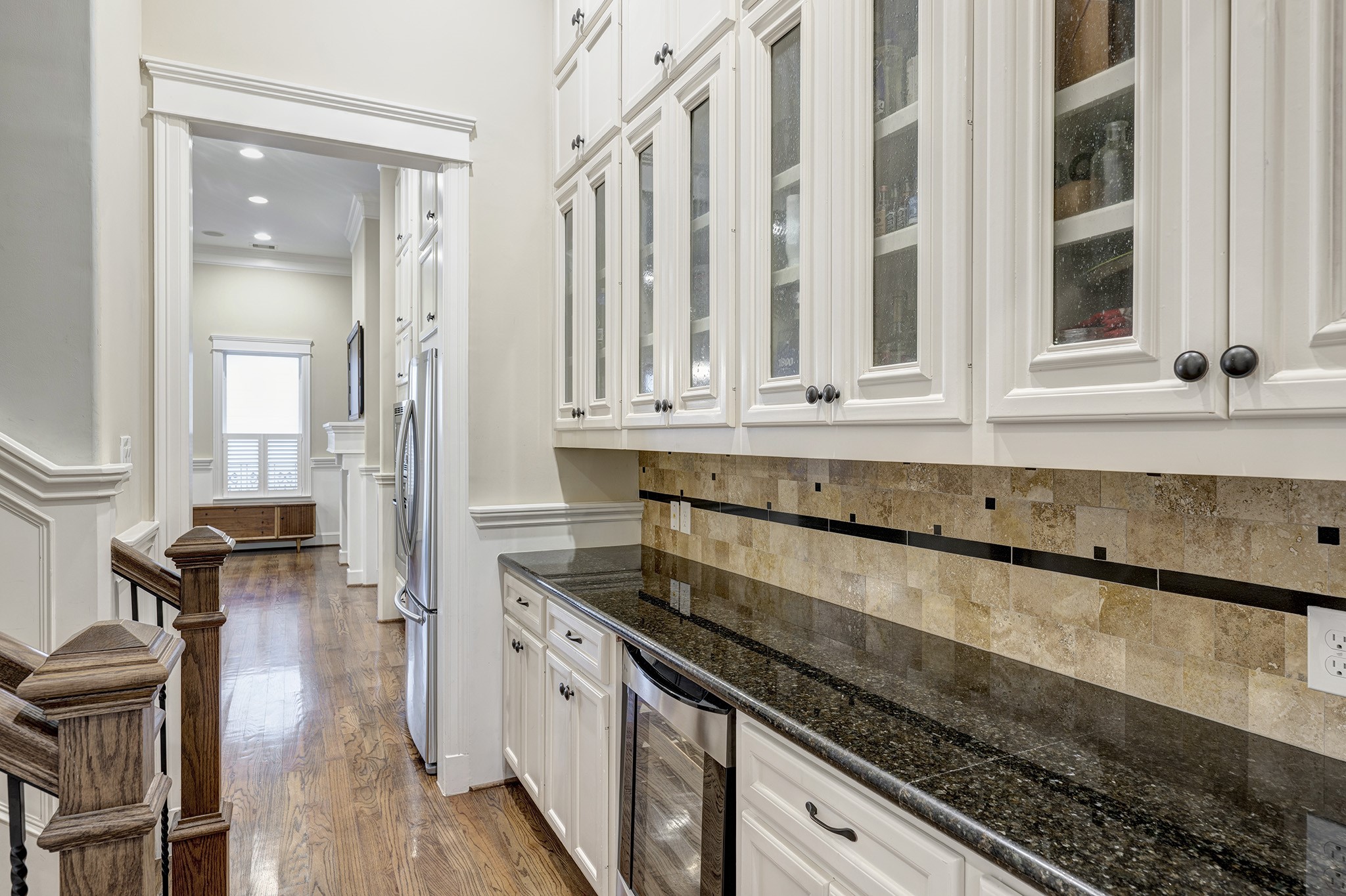 1010 Nicholson Street Houston, TX 77008 - Photo 7 of 28 a kitchen with granite countertop white cabinets and a wooden floor