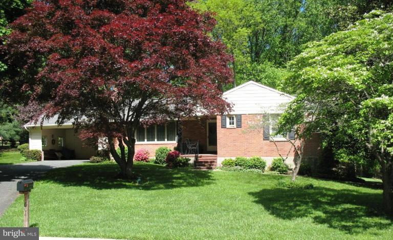 1604 Pinnacle Road Towson, MD 21286 - Photo 12 of 22 a front view of house with a garden and tree