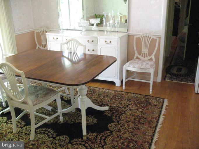 1604 Pinnacle Road Towson, MD 21286 - Photo 22 of 22 a kitchen with a table and chairs in it