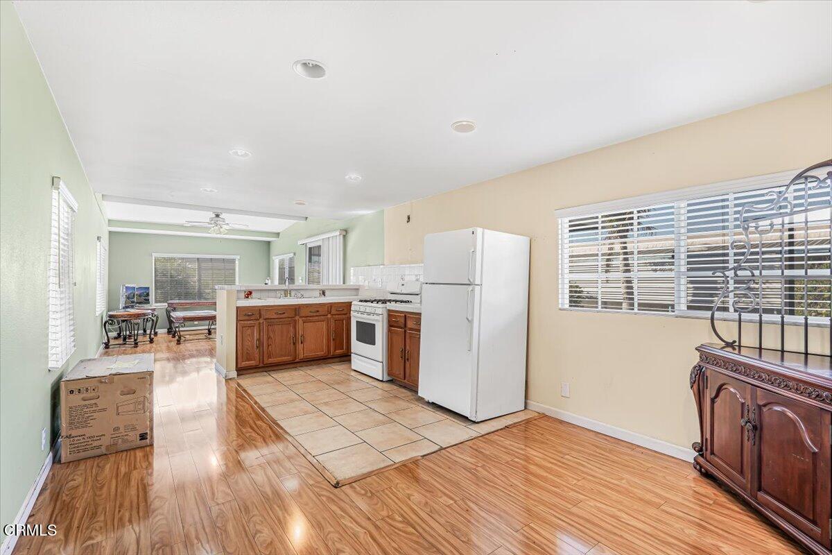 145 Ibsen Place, Unit 3 Oxnard, CA 93033 - Photo 15 of 47 a view of kitchen with furniture and wooden floor