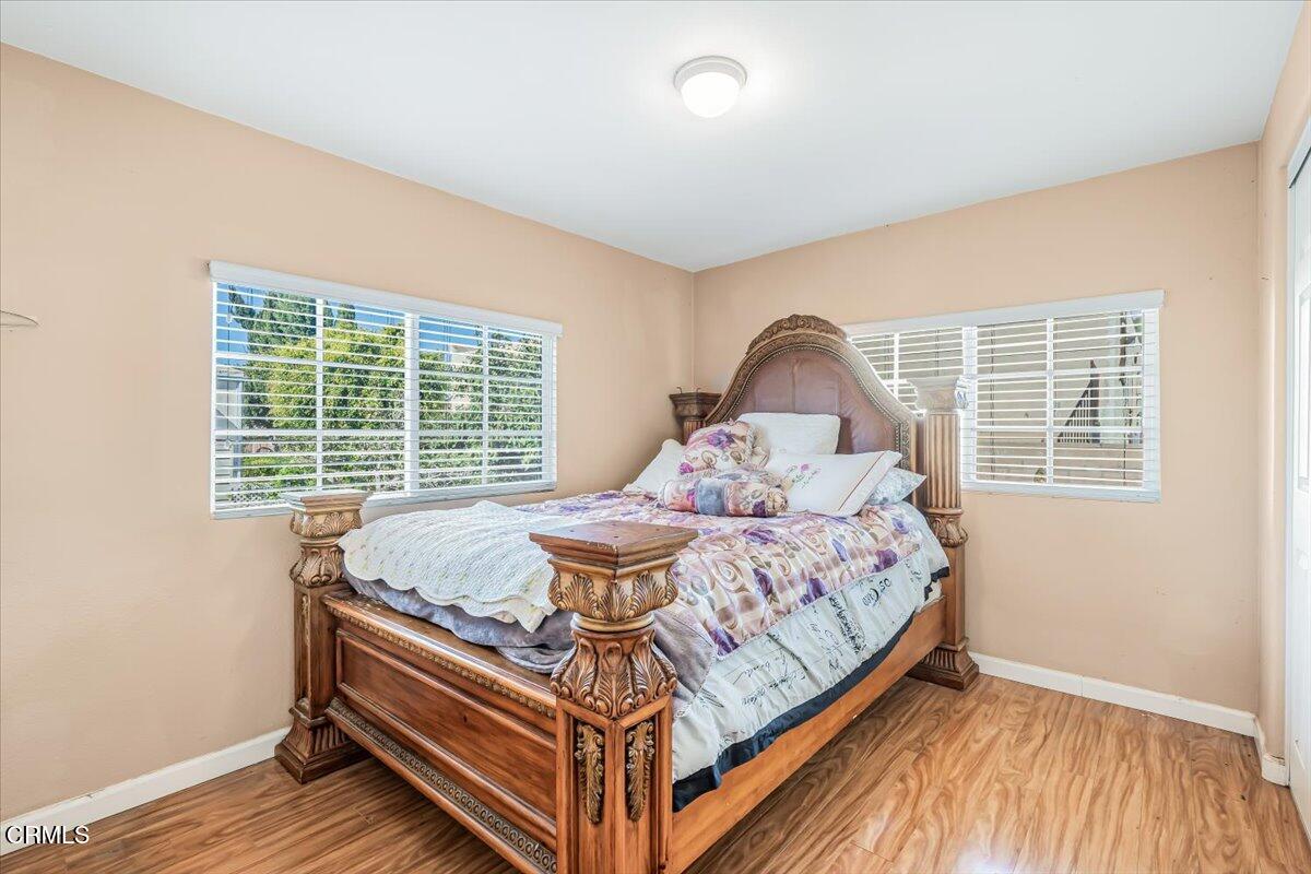 145 Ibsen Place, Unit 3 Oxnard, CA 93033 - Photo 20 of 47 a bed sitting in a bedroom next to a window