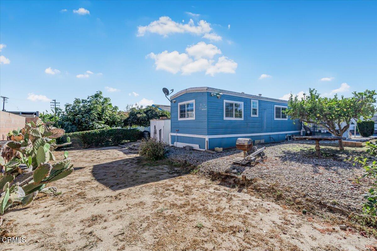 145 Ibsen Place, Unit 3 Oxnard, CA 93033 - Photo 24 of 47 a view of a house with a yard