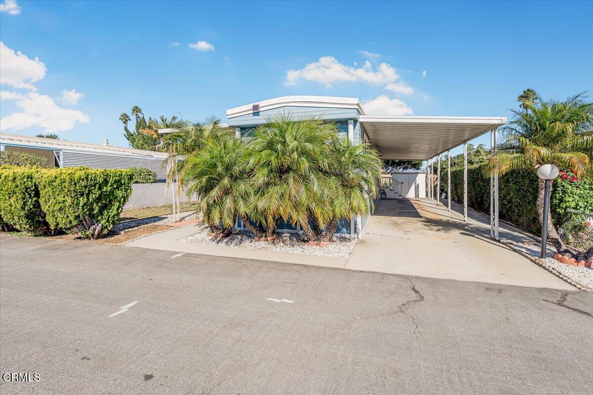 145 Ibsen Place, Unit 3 Oxnard, CA 93033 - Photo 5 of 47 a couple of palm trees in front of a building