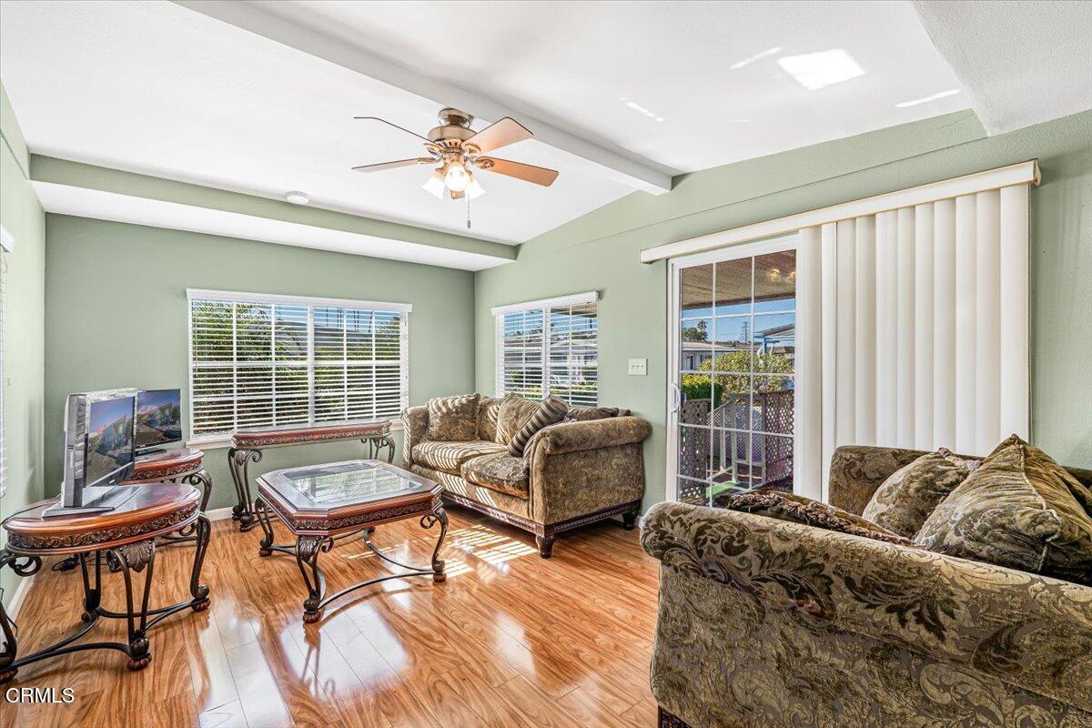145 Ibsen Place, Unit 3 Oxnard, CA 93033 - Photo 9 of 47 a living room with furniture and a large window