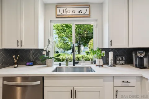a kitchen with a sink and cabinets