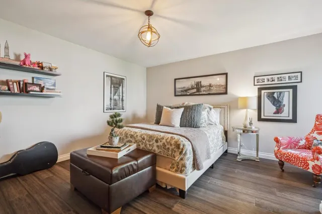 a bedroom with bed and a couch