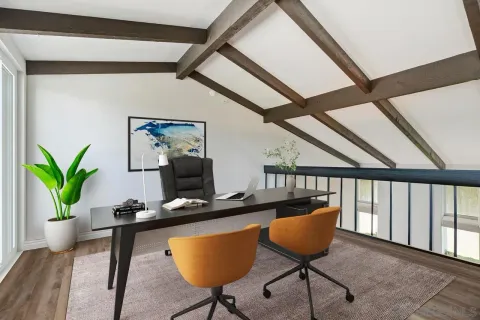 a dining room with furniture and a potted plant