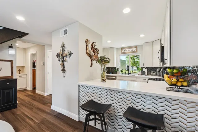 a view of a kitchen and dining room
