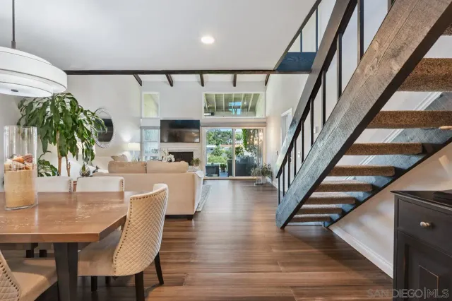 a dining room with furniture window and entryway