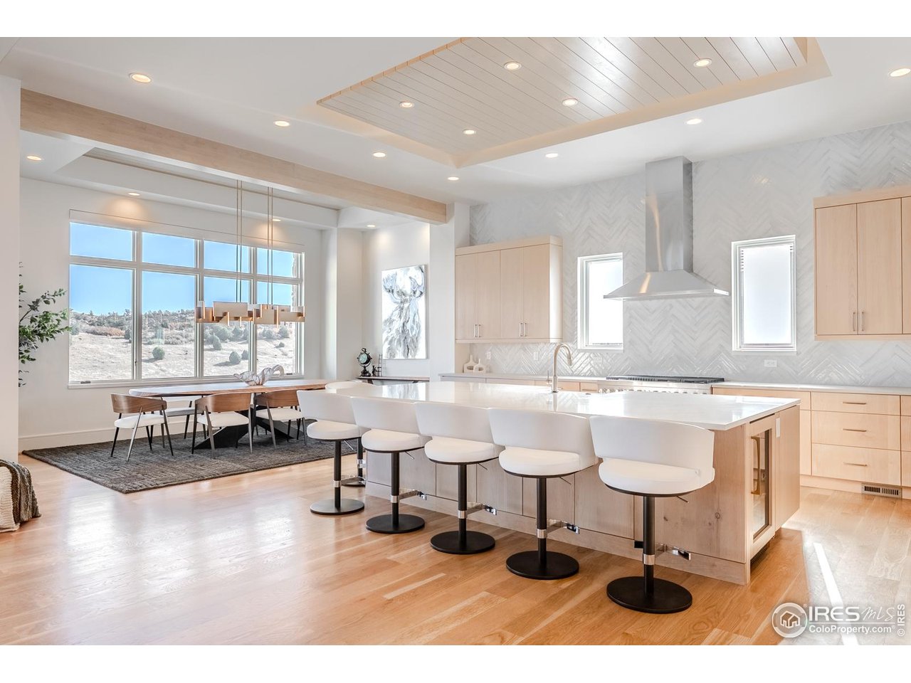 7572 Raphael Lane Littleton, CO 80125 - Photo 5 of 50 With an ethereal palette and design precision, the kitchen reveals itself as a sophisticated culinary studio tailored for both beauty and performance.