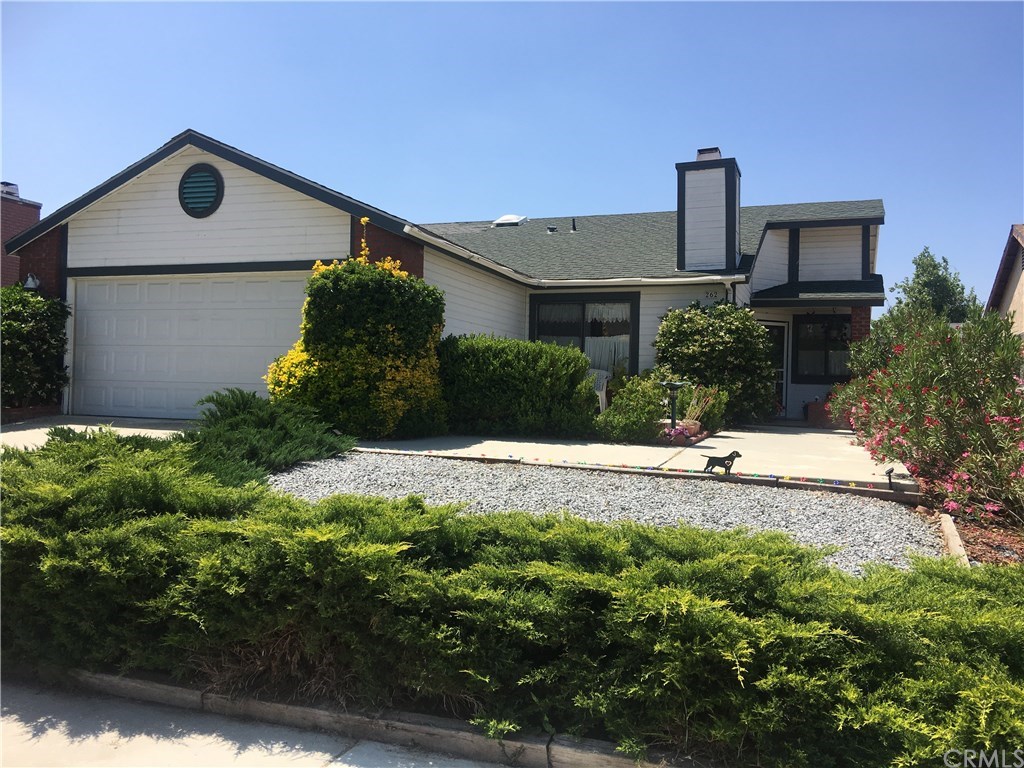 262 Quandt Ranch Road San Jacinto, CA 92583 - Photo 1 of 1 a front view of a house with a yard and garage