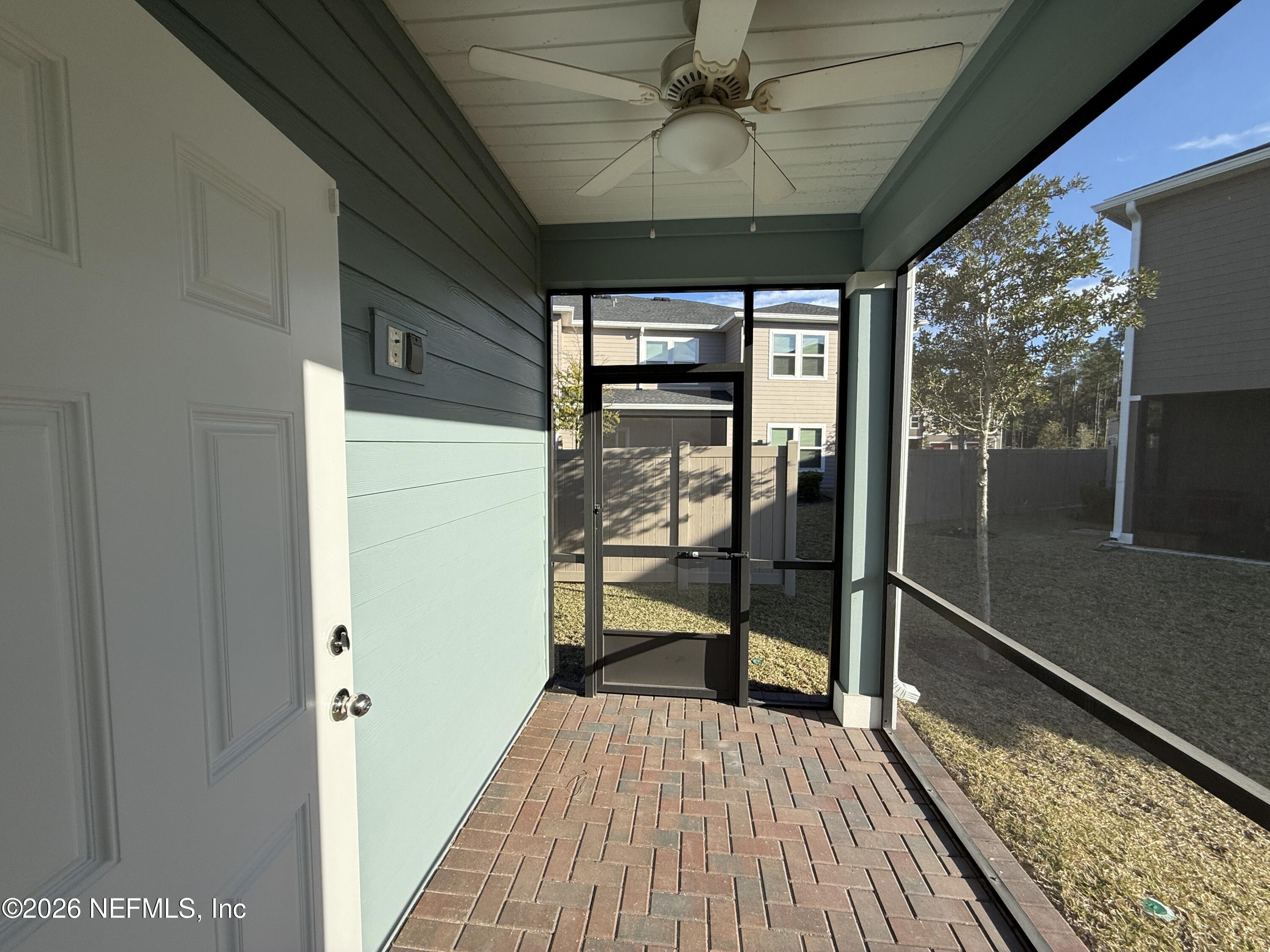 72 Bramble Court St. Augustine, FL 32092 - Photo 12 of 35 a view of a hallway with wooden floor and stairs