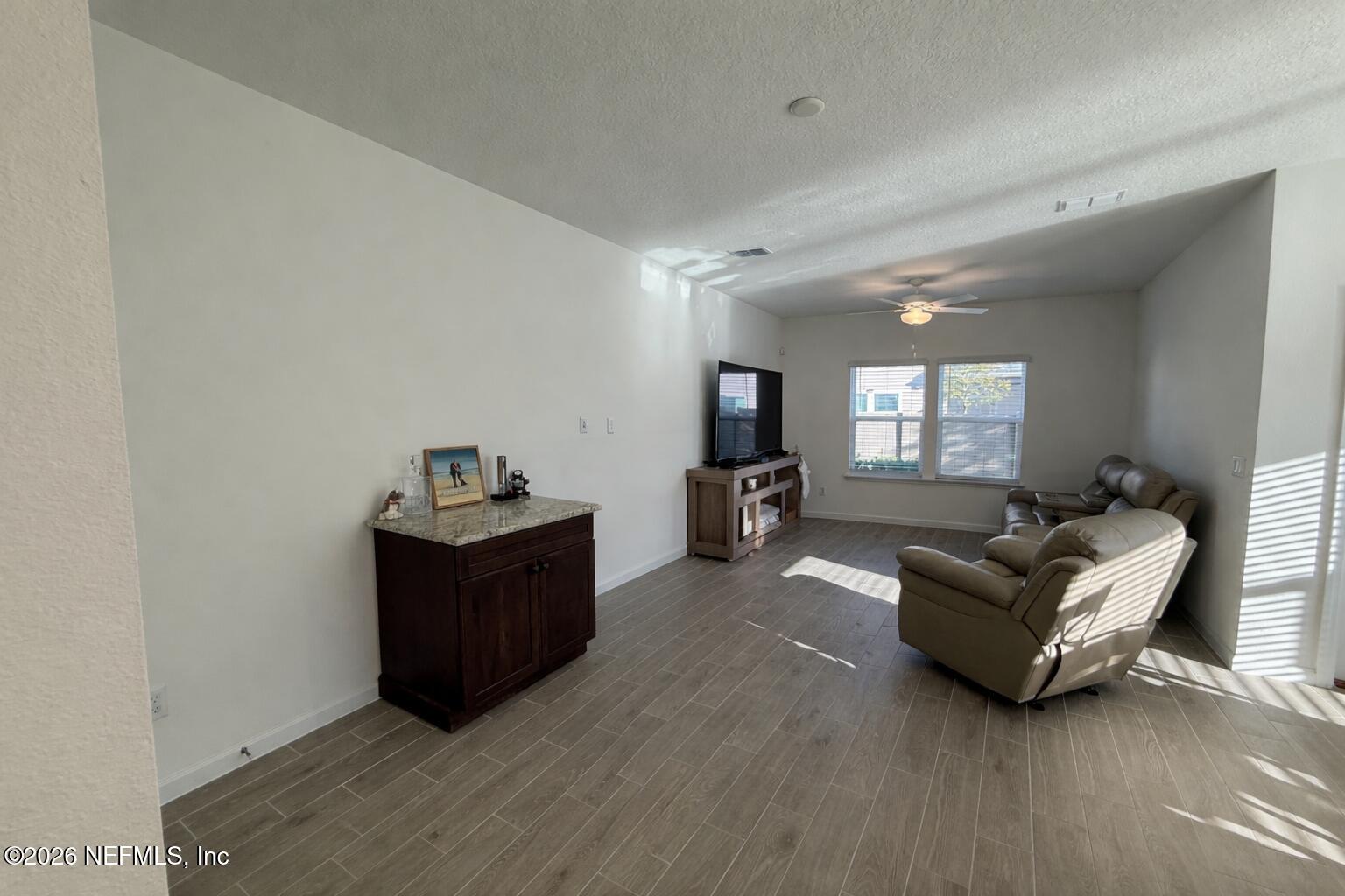 72 Bramble Court St. Augustine, FL 32092 - Photo 13 of 35 a living room with furniture and a flat screen tv