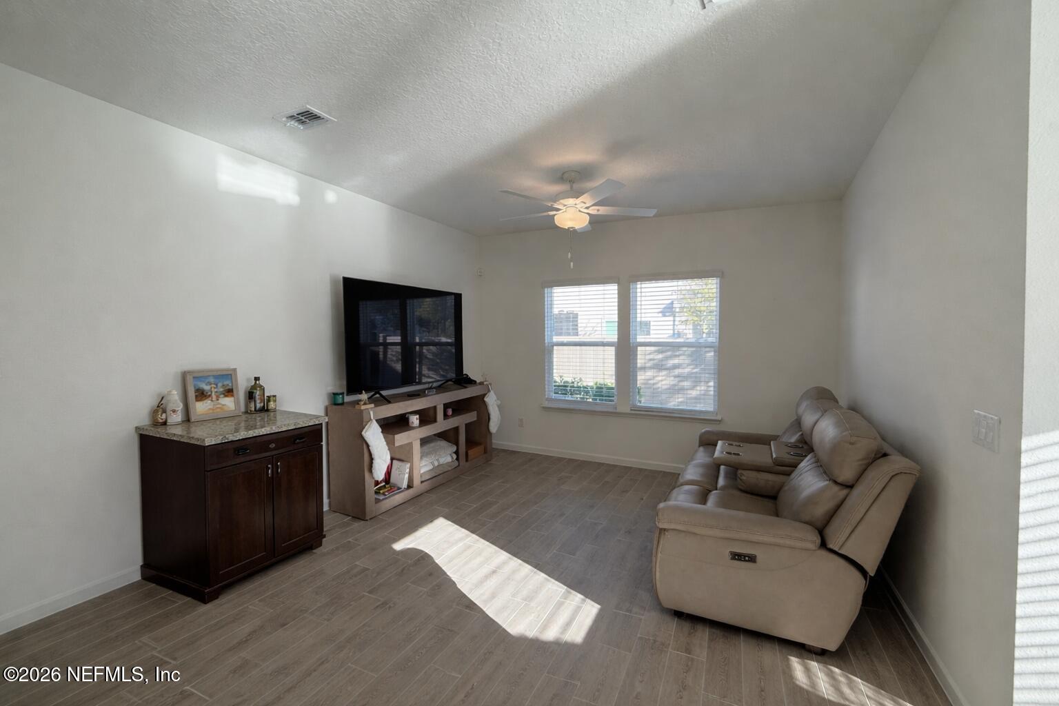 72 Bramble Court St. Augustine, FL 32092 - Photo 14 of 35 a living room with furniture and a flat screen tv