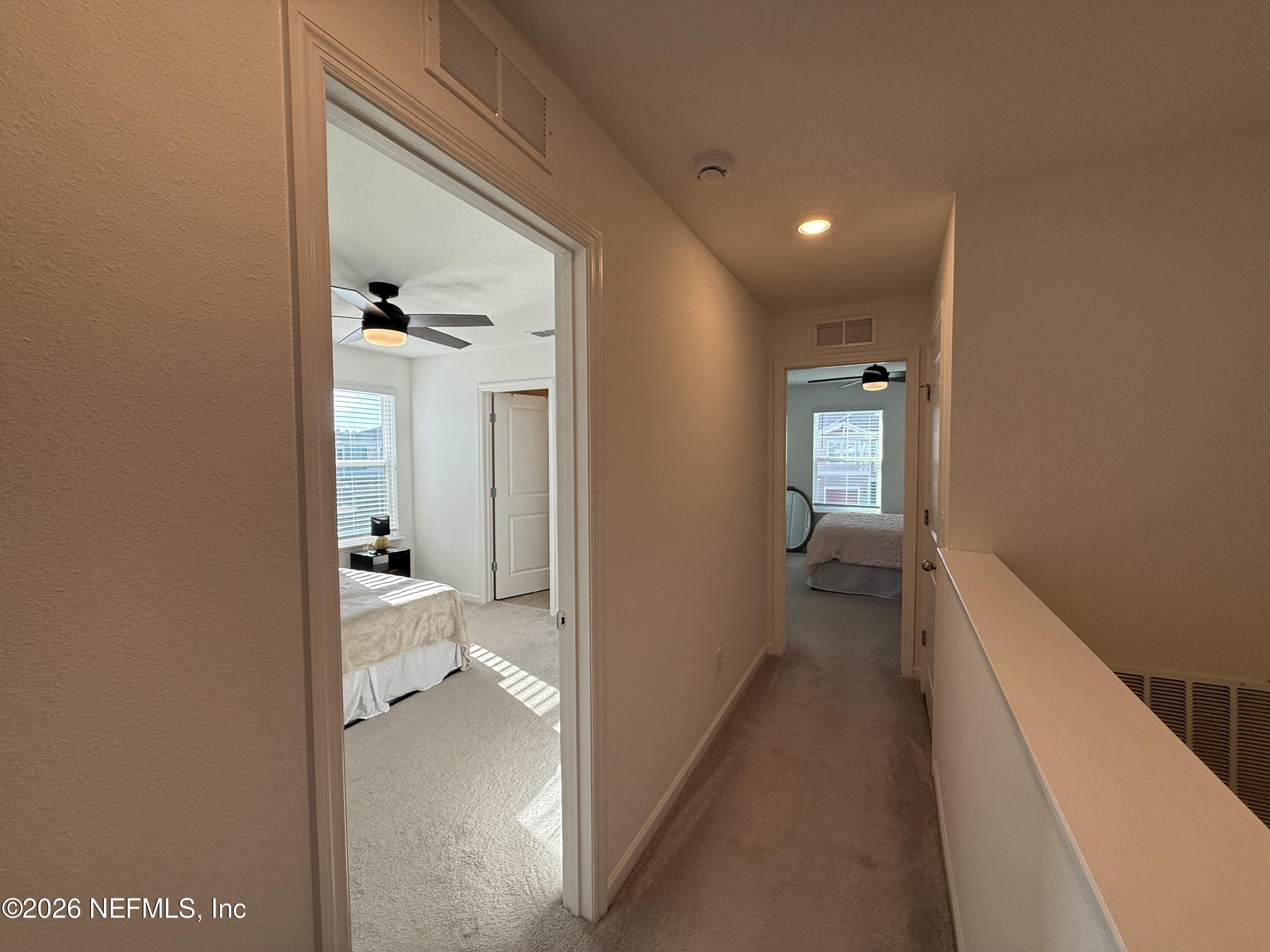 72 Bramble Court St. Augustine, FL 32092 - Photo 25 of 35 a view of a hallway with a livingroom and a bathroom