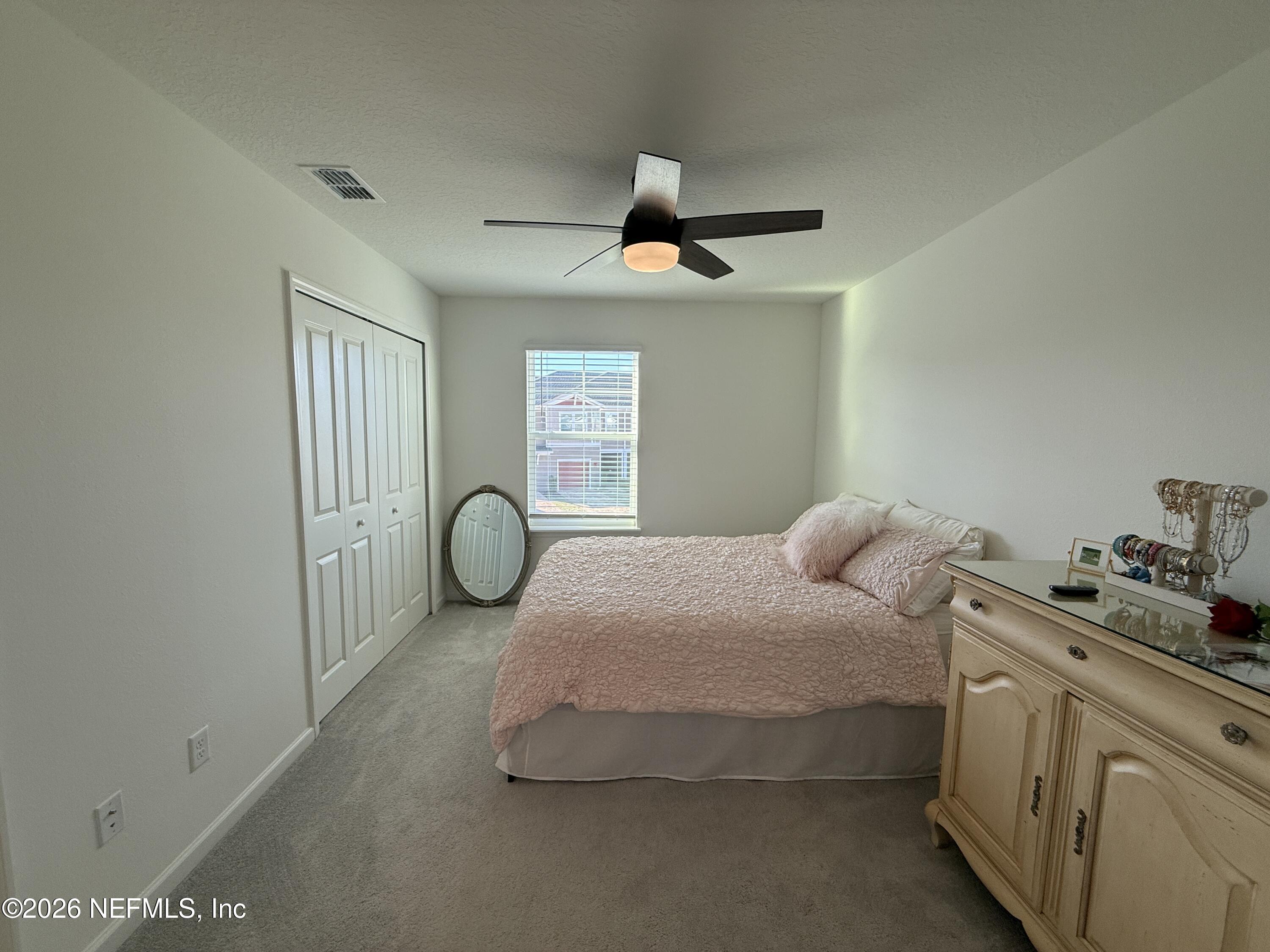72 Bramble Court St. Augustine, FL 32092 - Photo 32 of 35 a bedroom with bed and window