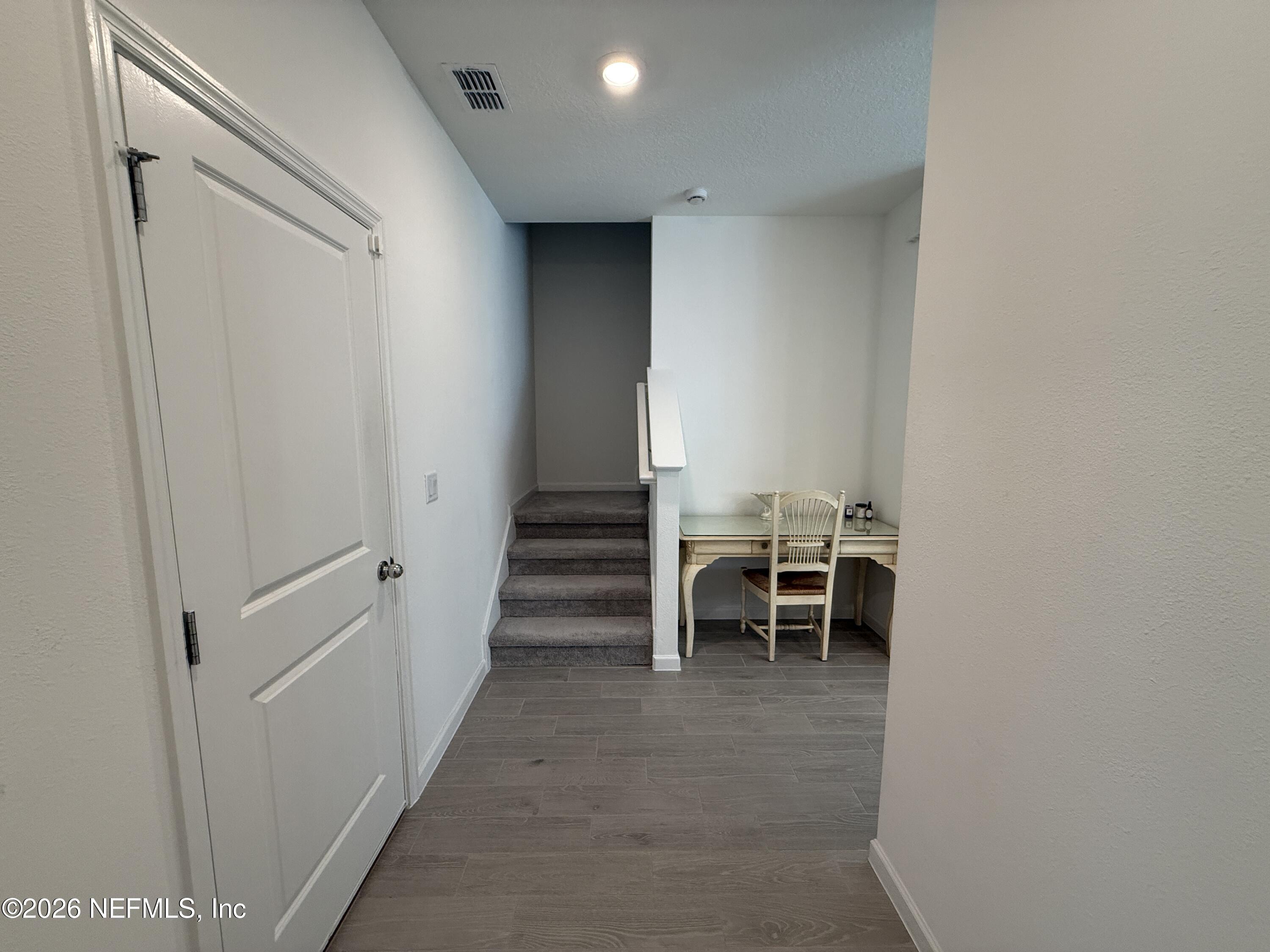 72 Bramble Court St. Augustine, FL 32092 - Photo 4 of 35 a view of a hallway with chairs