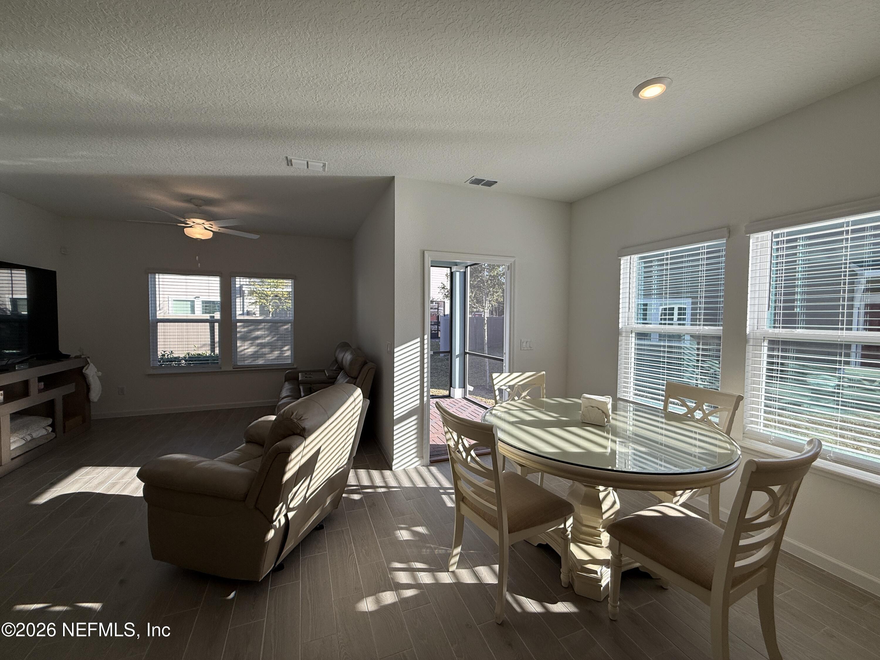 72 Bramble Court St. Augustine, FL 32092 - Photo 10 of 35 a living room with furniture and large windows