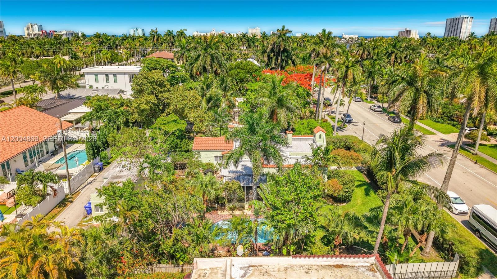 1029 Harrison Street Hollywood, FL 33019 - Photo 64 of 74 Looking East - Harrison Street to the right and alley to the left. Buildings along the beach in the distance