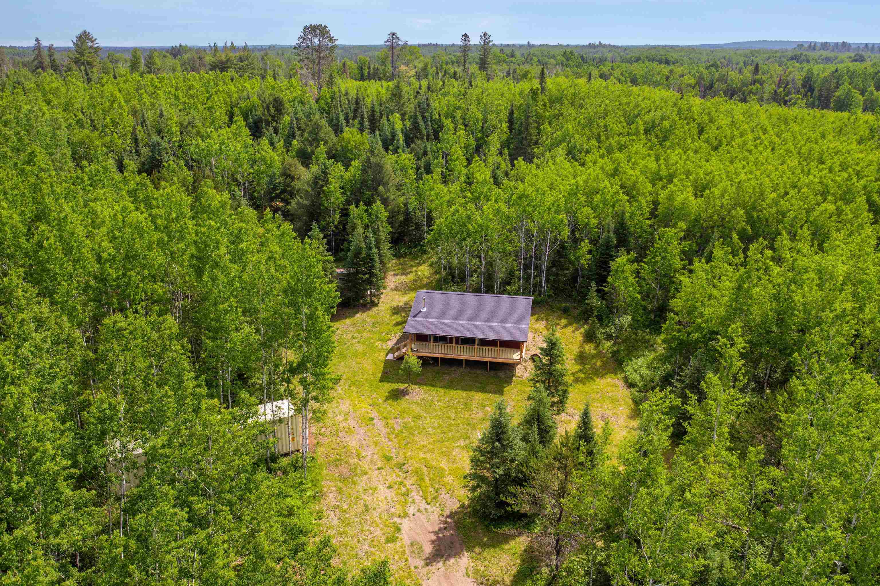 1612 Pequaywan Lake Road Brimson, MN 55602 - Photo 35 of 45 Aerial view of property and surrounding area featuring a forest