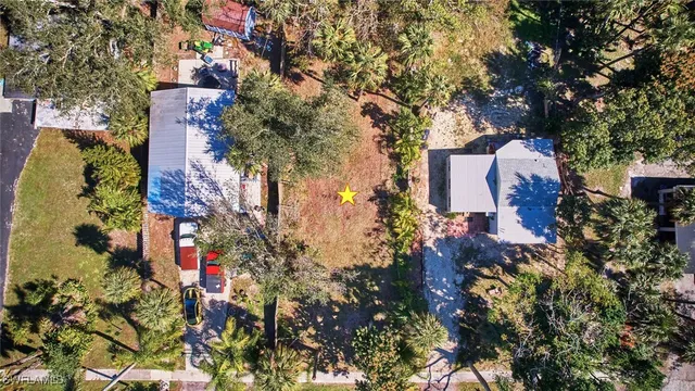 a view of a lake with houses in the back