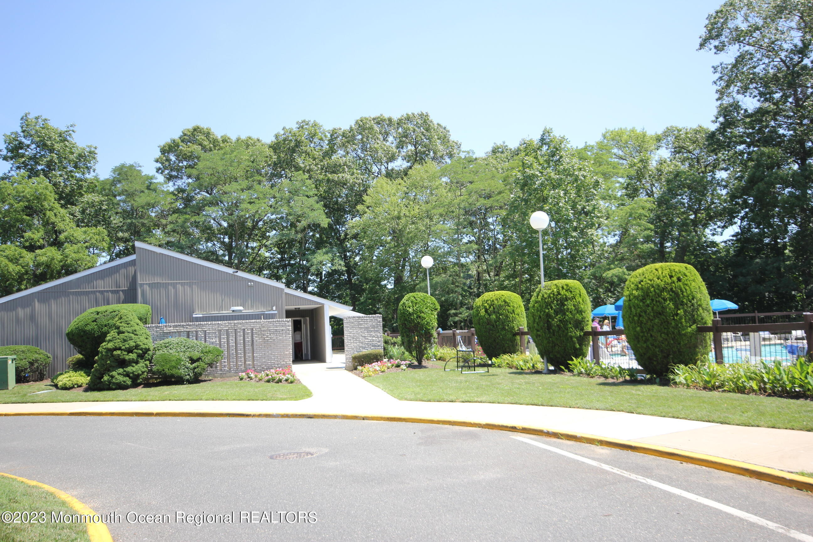 29 Manchester Court Red Bank, NJ 07701 - Photo 42 of 49 front view of house with a yard and potted plants