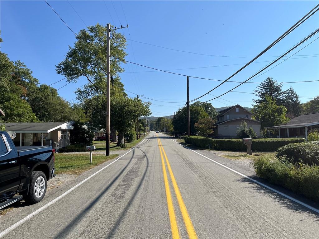 131 Hopwood Coolspring Road Hopwood, PA 15445 - Photo 12 of 12 a view of a house with backyard and sitting area