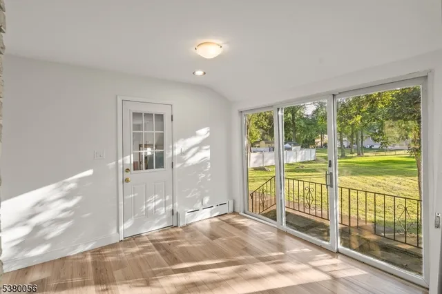 a view of a room with a large window