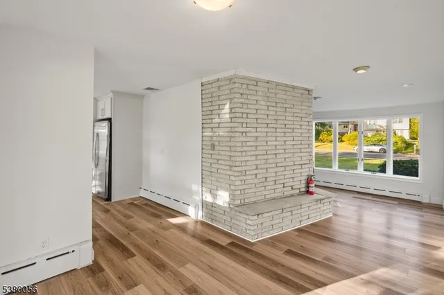a view of an empty room with glass door