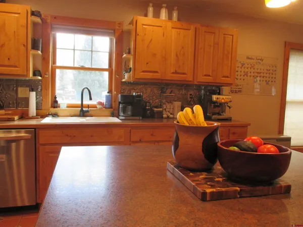 a room with a sink and cabinets