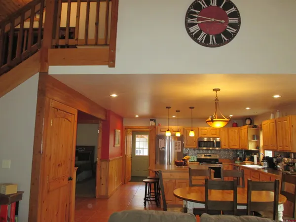 an open kitchen with a table and chairs