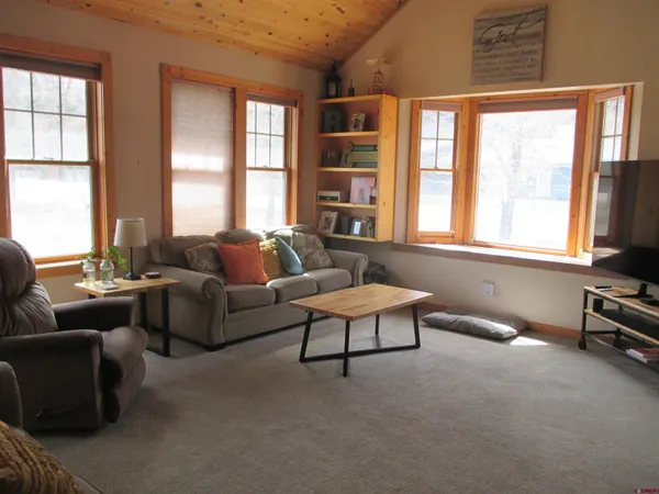 a living room with furniture and a window