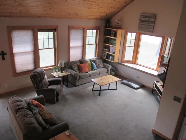 a living room with furniture and windows